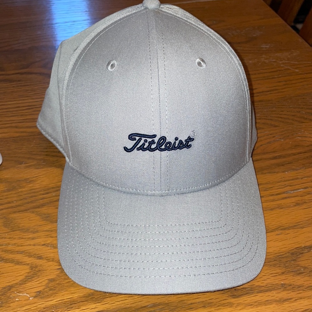 Titlesit hat is gray with blue titleist insignia on front. Like new.
